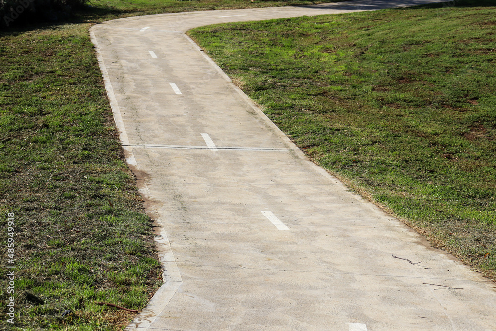curving bike and walking path in parkland curving bike and walking path in parkland