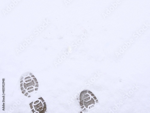 Big shoe prints in the pristine white snow