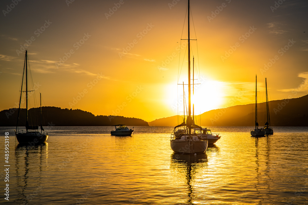 beautiful sunrise on lake nahuel huapi with boats