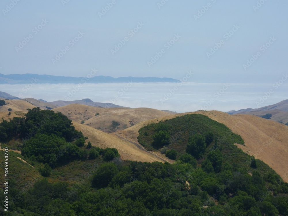Rolling hills and mountains along Highway 46 in California.