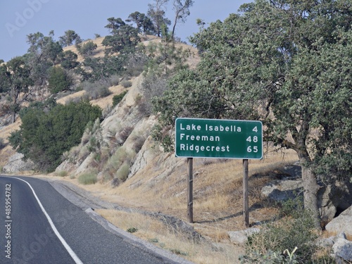 Roadside sign and directions to Lake Isabella, Freeman and Ridgecrest, Kern County California
