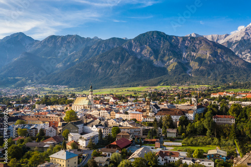 Austria small town with spire church mountain backdrop