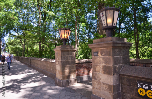 Photography Sidewalk view of vintage subway lamps at Central Park South on sunny summer afternoon