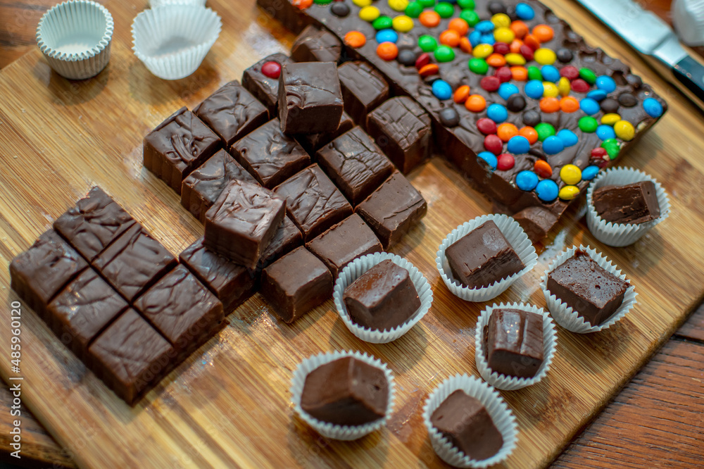 Chocolate fudge and fudge with candy dots are being made at home for sweet trays during the holidays Chocolate fudge and fudge with candy dots are being made at home for sweet trays during the holidays