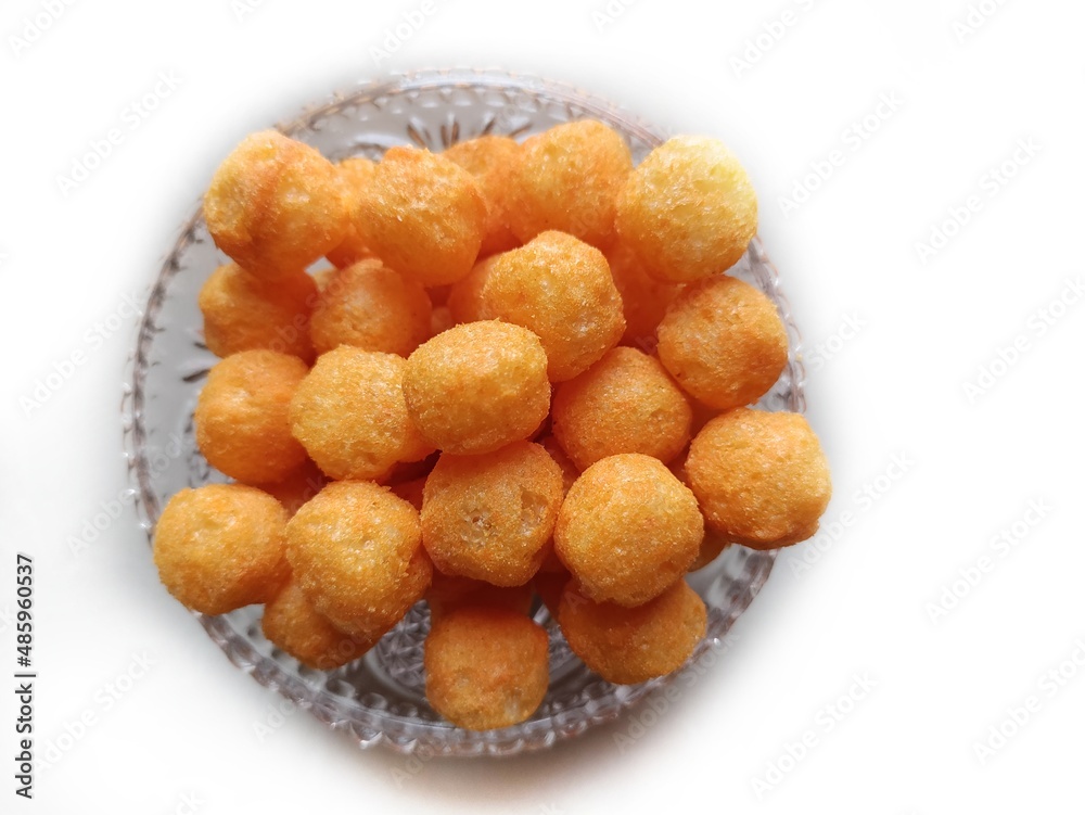 Cheese puffs balls, cheese curls, cheese ball puffs, cheesy puffs, or corn curls are a puffed corn snack, coated with a mixture of cheese or cheese-flavored powders. Cheese puffs balls, cheese curls, cheese ball puffs, cheesy puffs, or corn curls are a puffed corn snack, coated with a mixture of cheese or cheese-flavored powders.