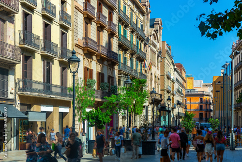 View of Portal del Angel, most visited pedestrian street in large shopping area of Barcelona on sunny summer day, Spain