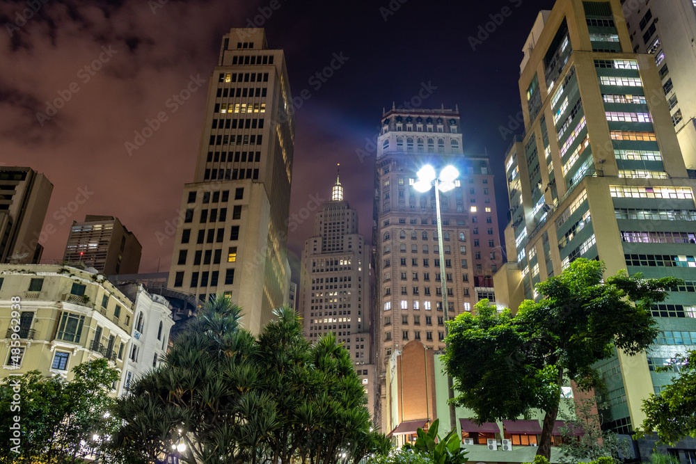 skyline in downtown Sao Paulo, with Old Banespa or Altino Arantes, Martinelli and Bank of Brazil buildings, in Anhangabau Valley at night.