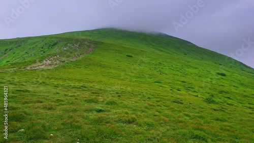 The peak of Mount Hoverla in mist, Carpathians, Ukraine photo