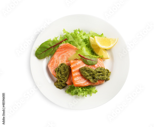 Tasty cooked salmon with pesto sauce on white background, top view