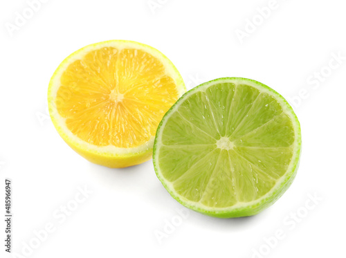 Halves of fresh ripe lemon and lime on white background