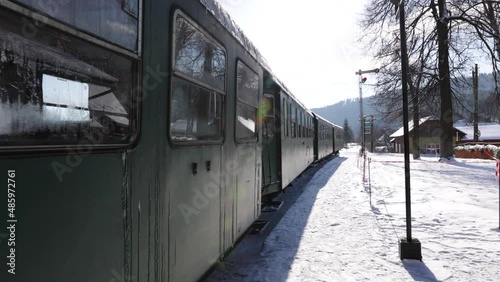 Train at Moldovita Forest Railway - POV Of A Person Walking Along The Steam-powered Train In Mocanita Hutulca Railway Station In Moldovita, Romania. photo