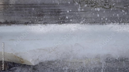 Rough Edges Of Makrana Marble Being Cut In Manufacturing Production. Close Up photo