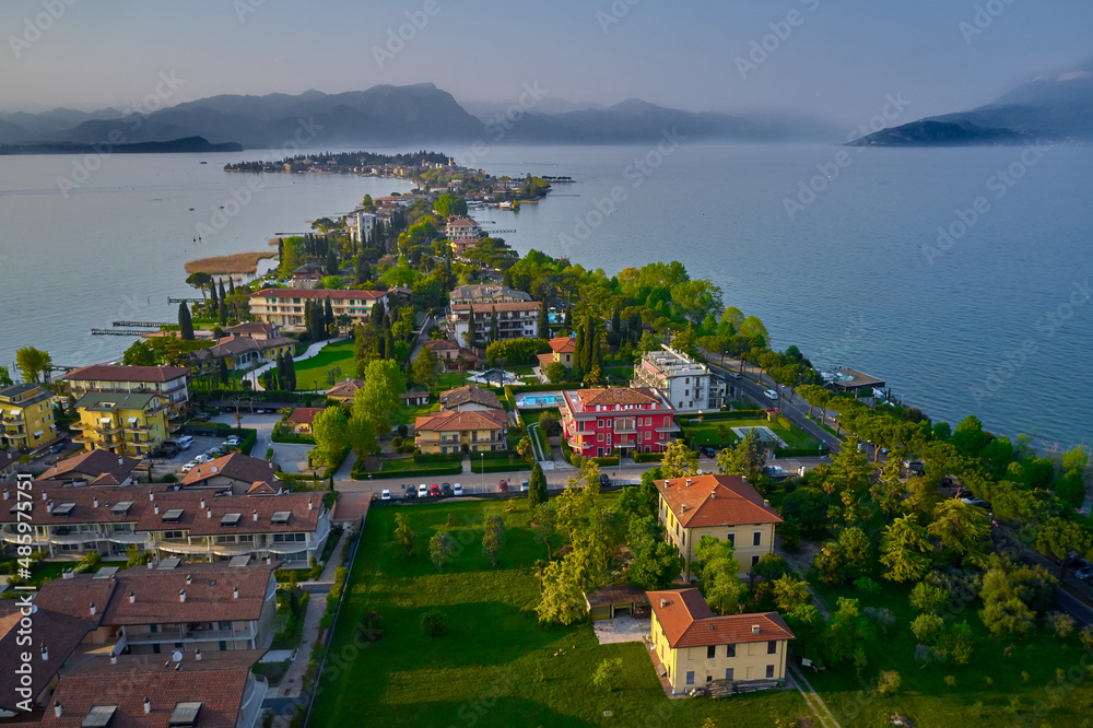 Parco San Vito in Colombare, Sirmione. Panoramic aerial view of the Sirmione peninsula on Lake Garda, Italy. Sirmione, lake garda in the background of the alps. Sirmione aerial view.