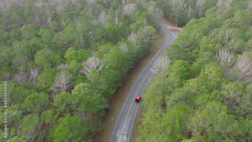 Aerial Tilt of a Jeep Wrangler on a Rural Winding Road Aerial Tilt of a Jeep Wrangler on a Rural Winding Road