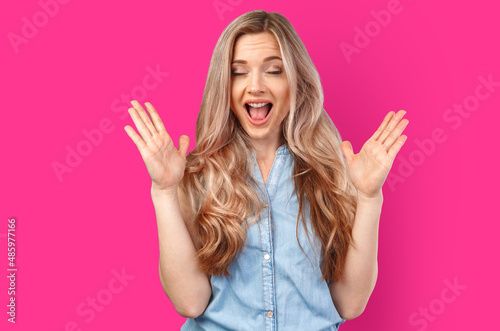 Emotional angry woman screaming on color isolated studio background.
