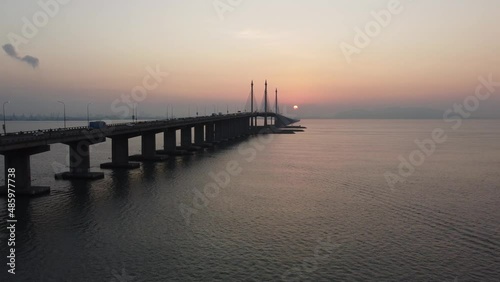 Aerial fly toward midspan of Penang Bridge in sunrise morning photo