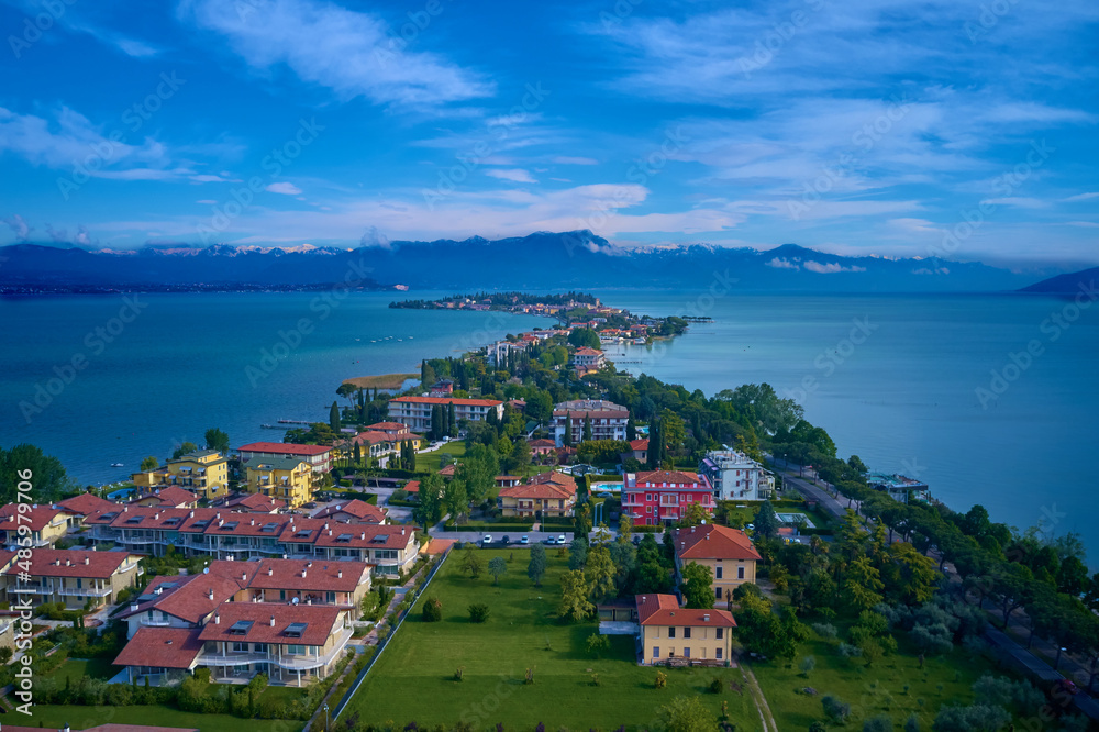 Parco San Vito in Colombare, Sirmione. Sirmione, lake garda in the background of the alps. Sirmione aerial view. Panoramic aerial view of the Sirmione peninsula on Lake Garda, Italy.
