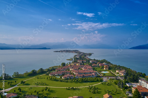 Panoramic aerial view of the Sirmione peninsula on Lake Garda, Italy. Sirmione, lake garda in the background of the alps. Sirmione aerial view.