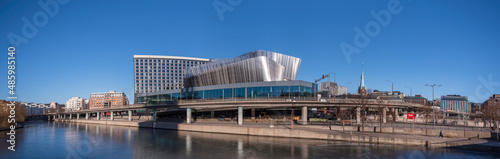 Panorama view over the canal Karlbergskanalen, apartment houses, hotels and the modern styled congress building Stockholm Waterfront embedded in traffic routes a sunny winter day in Stockholm