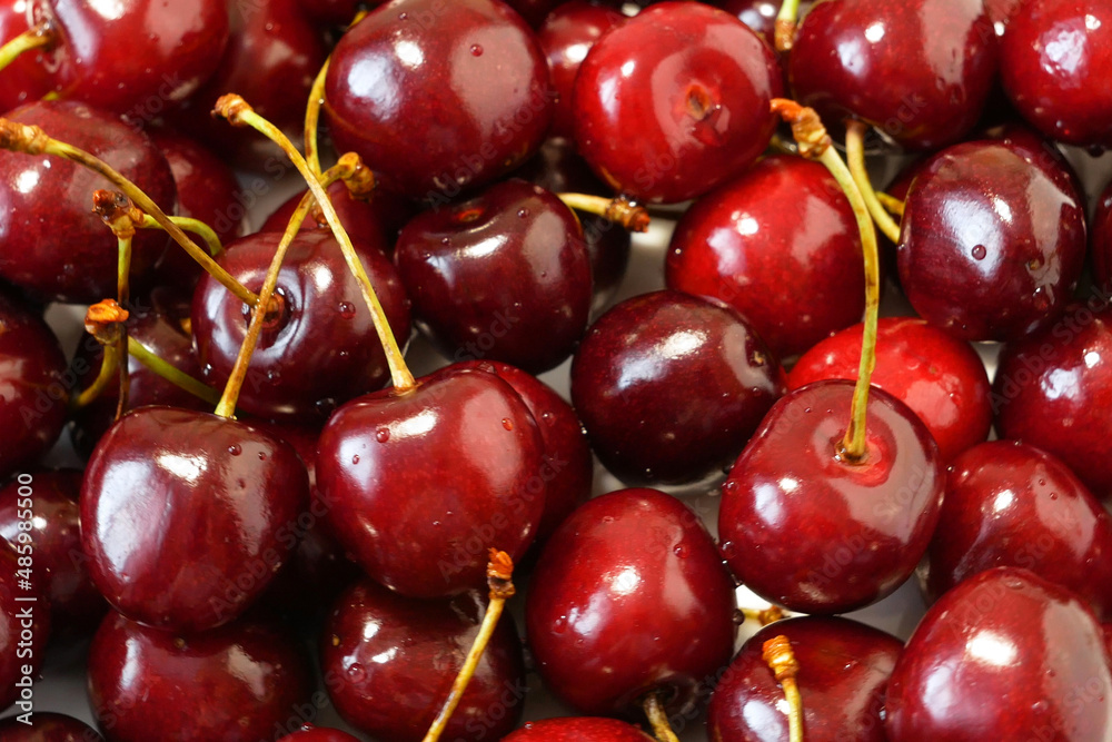 heap of fresh tasty cherries as textured background, top view heap of fresh tasty cherries as textured background, top view