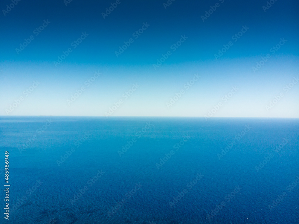 Seascape against blue clear sky Seascape against blue clear sky