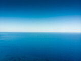Seascape against blue clear sky