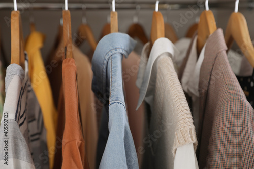 Wardrobe closet with different stylish clothes, closeup