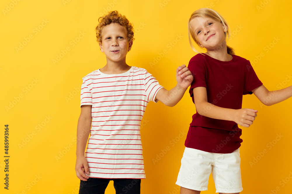 Portrait of cute children cuddling fashion childhood entertainment isolated background Portrait of cute children cuddling fashion childhood entertainment isolated background