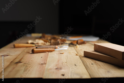 Wood carving process concept with free space on top. Focus on an empty space in the foreground. Mockup background for product presentation photo