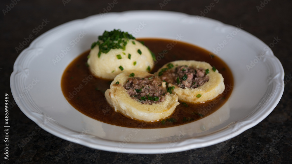 cooking at home and ready to eat, greaves dumpling in brown sauce from a roasted venison and chives cooking at home and ready to eat, greaves dumpling in brown sauce from a roasted venison and chives