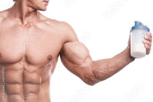 Fotografie Muscular bodybuilder with a shaker full of whey protein