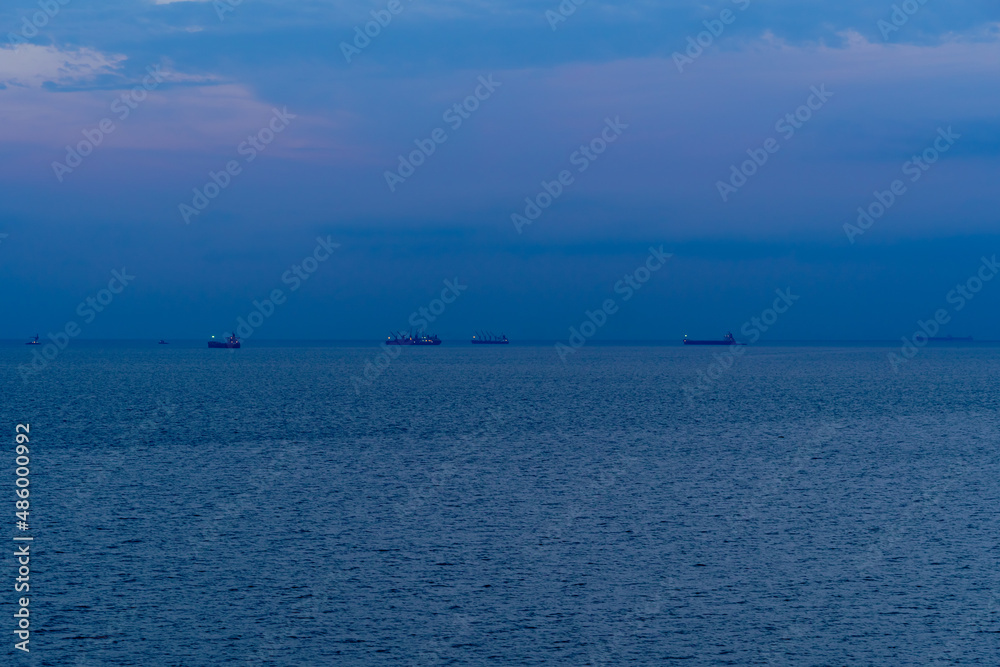 sunset, ships at sea, seascape with blue sky