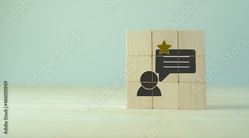 Customer experience, feedback, satisfation evaluation concept. Rank rating stars feedback. The wooden cubes with customer experience icon on grey background, copy space. Marketing banner support. photo