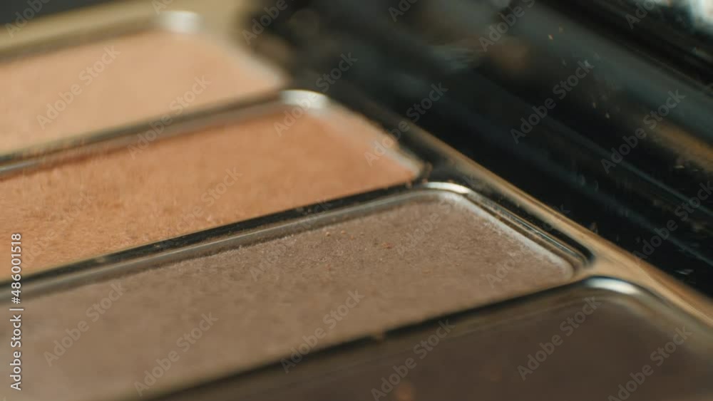 This close-up video showcases a rotating professional makeup eyeshadow palette of browns. This close-up video showcases a rotating professional makeup eyeshadow palette of browns.