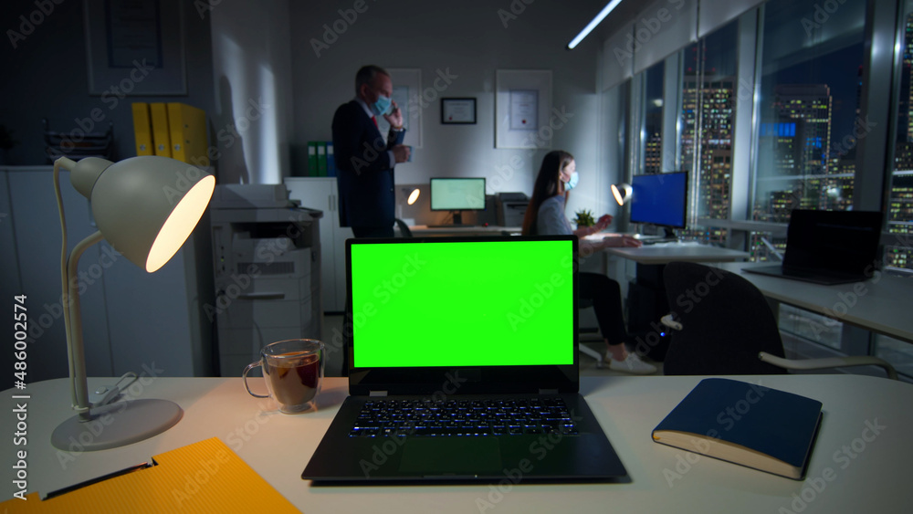 custom made wallpaper toronto digitalLaptop with green screen on desk and employees in safety mask working on background
