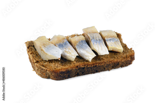 resh rye bread sandwich with herring isolated on white background.