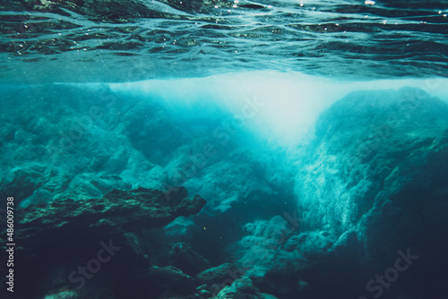 Underwater scene with sunlight on rocks © bruno135_406