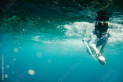 Boy with swimming mask snorkeling in sea