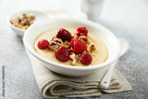 Bild auf Leinwand Homemade semolina pudding with raspberry and nuts
