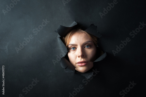 The girl's face appears on a black background.