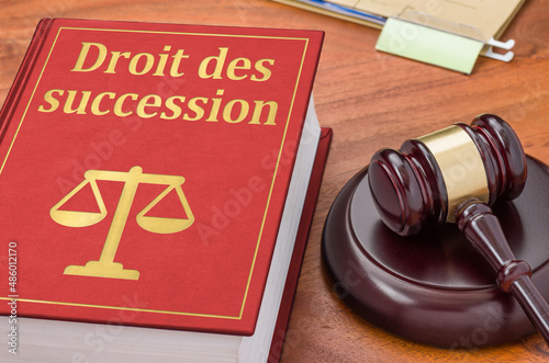 A law book with a gavel - Law of succession in french - Droit des succession photo