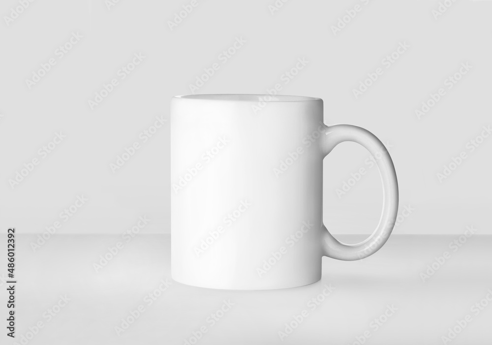 Obraz premium Blank ceramic mug on white background. Mockup for design