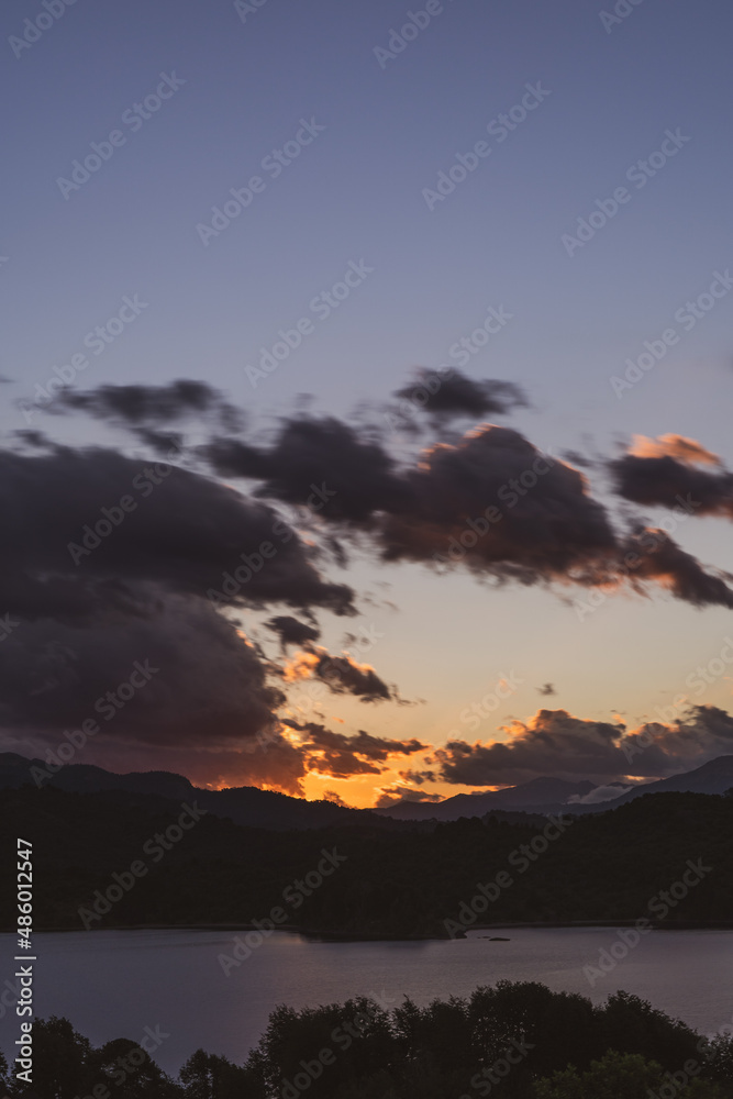 sunset over the mountains and clouds