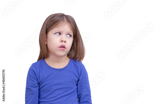 Little girl looking aside at something with distrust
