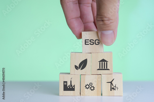Wooden cubes with ESG Environmental social and governance symbol on background and copy space.Business concepts.