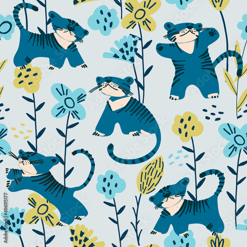 Seamless pattern with blue tiger cubs playing among the flowers. Childs drawing style. Wallpaper, backgound for kids. Perfect for baby, toddler clothing, bed linen
