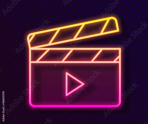 Glowing neon line Movie clapper icon isolated on black background. Film clapper board. Clapperboard sign. Cinema production or media industry. Vector