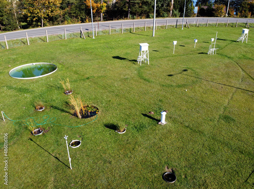 A meteorological garden with many devices for measuring weather phenomena. Equipment on meteorological station to monitor weather events photo