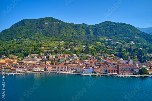 Panoramic view of the historic part of Salò on Lake Garda Italy. Special View by Drone - Flying in Garda lake - Salò for an italian summer. Tourist on the lake.