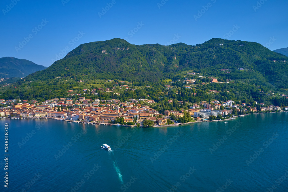 Panoramic view of the historic part of Salò on Lake Garda Italy. Salò on Garda Lake in the summer, little village in italy, view by Drone for your holidays in Italy.